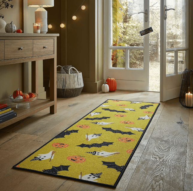 Halloween printed runner on the floor of a livingroom