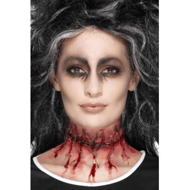 Female face with black eye makeup and neck that looks like it's been cut for Halloween