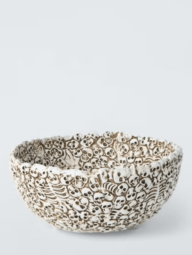 White bowl covered in small skull detail