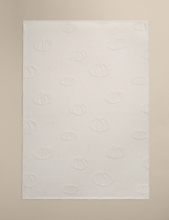 White blanket with pumpkin detail