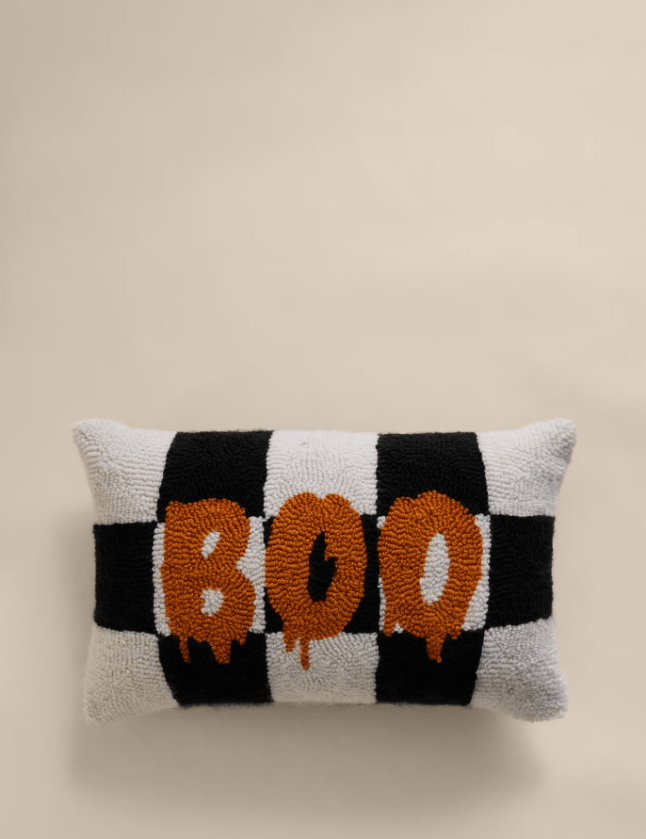 Black and white cushion with the word 'boo' in orange across the front
