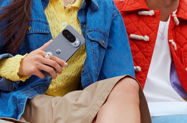 Model holding a phone against their chest