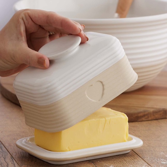 White butter dish, exposing butter