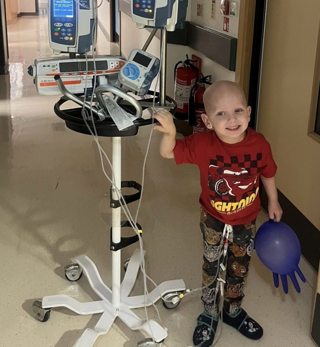 Raffi Starkowitz undergoing chemotherapy. A little boy has been diagnosed with a rare brain cancer after he was spotted "walking unsteadily" at nursery.Four-year-old Raffi Starkowitz was at nursery when he suddenly began unsteady on his feet and would lean to one side in March 2025. His parents Neil, 47, and Nicky , 46, were called and thought it was strange, and took him to A&E. An emergency MRI scan showed he had a space-invasion lesion, and he was rushed to Great Ormond Street Hospital, where he underwent a 10-hour operation to remove the mass on his brain. Photo released 19/11/2025