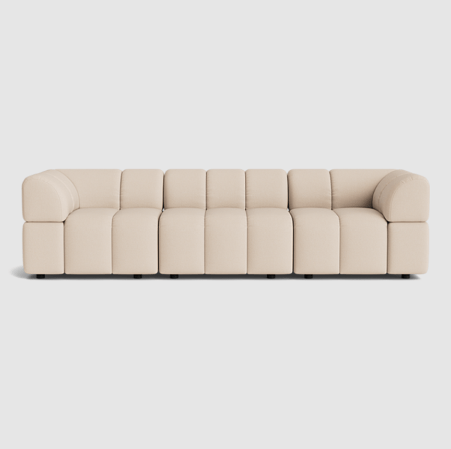 Cream sofa with many small cushions
