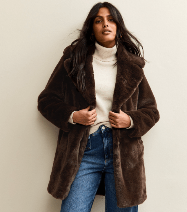 Model wears brown faux fur jacket