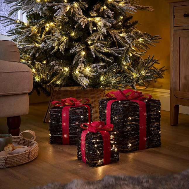 Lightup presents under a lit Christmas tree