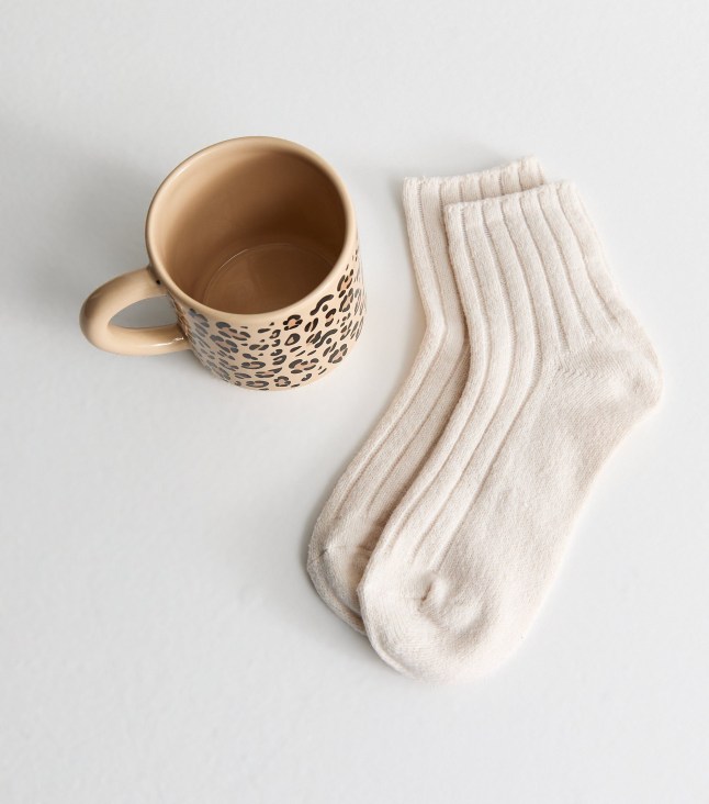 Pair of cream socks and mug set