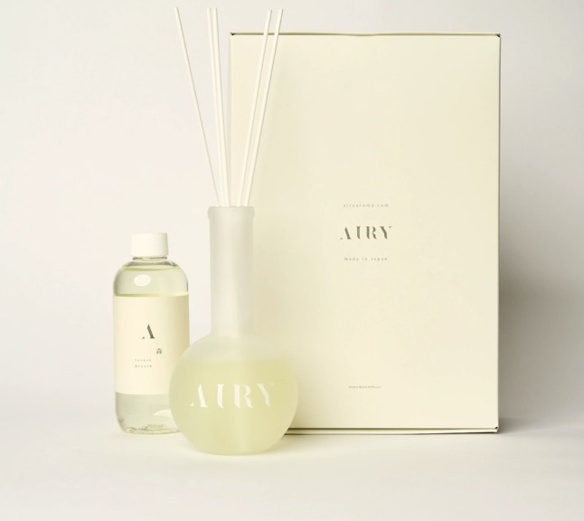 Glass bottle with diffuser reeds in