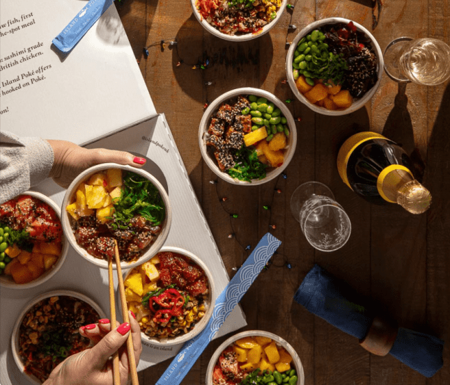 Different bowls of rice and toppings (poke bowl)