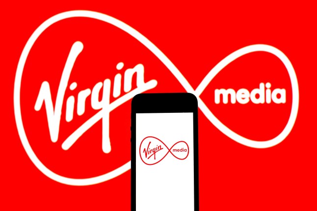 Mandatory Credit: Photo by Thiago Prudencio/SOPA Images/REX/Shutterstock (12256327aj) In this photo illustration a Virgin Media Inc logo seen displayed on a smartphone. Illustrations in Spain.