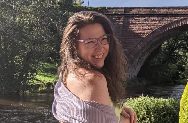 Hannah Shewan Stevens smiles in formal dress
