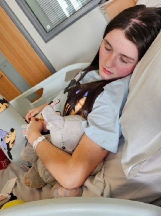 Katie-Jo Bartlett, in hospital. // A teen's 'exam stress' was actually a sign she had a brain tumour. Katie-Jo Bartlett, 19, said she would see 'colours' on her exam paper which would make her feel sick, and developed a 'squint' walk and back pain. Despite visits to her GP her symptoms were dismissed as "exam stress" by doctors until she collapsed in the toilet and was blue-lighted to Northumbria Specialist Emergency Care Hospital, in Cramlington, Northumberland. Doctors diagnosed Katie-Jo with severe hydrocephalus - an abnormal build-up of fluid in the brain - and she was rushed to Royal Victoria Infirmary, Newcastle, to drain it. Photo released 08/12/2025 Photo released 15/12/2025