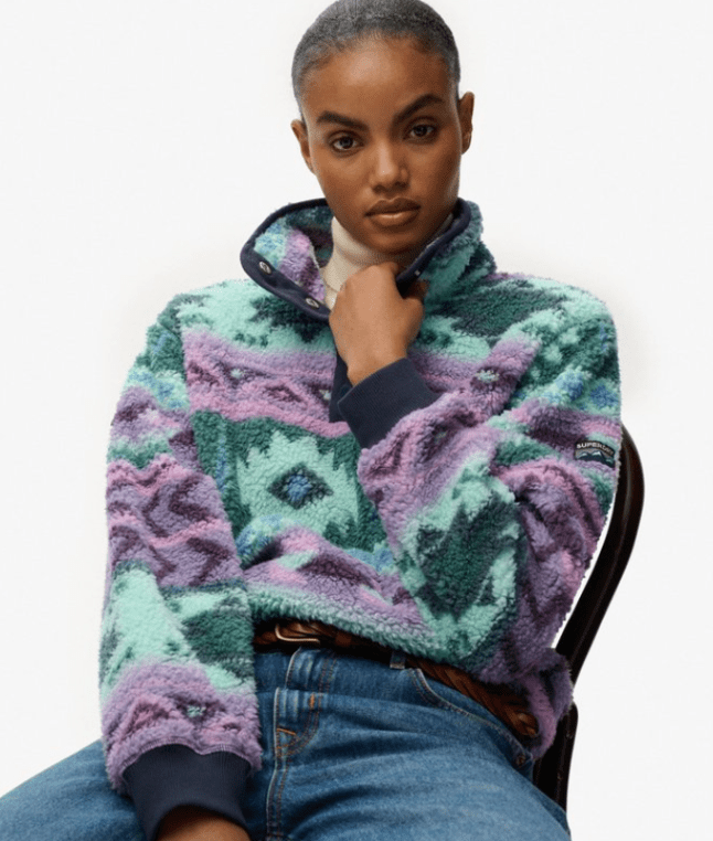 Female wears printed fleece jumper