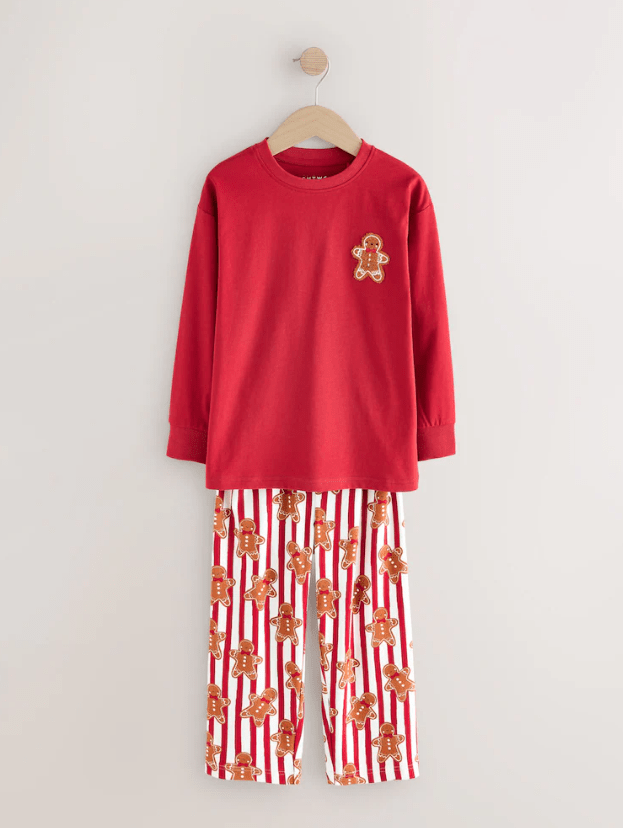 Red pjs with gingerbread man on the front, and stripe trousers