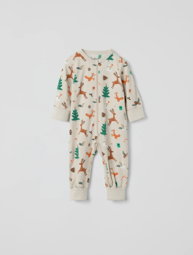 Sleepsuit with festive print including trees and reindeer