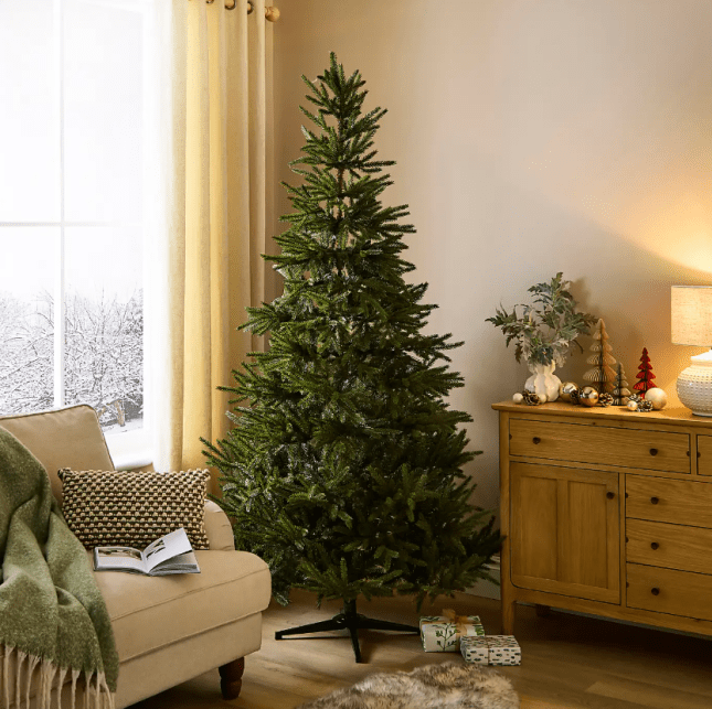 Large Christmas tree in the corner of a livingroom