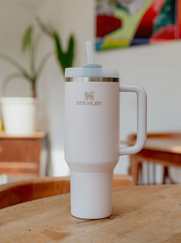 Pink tumbler with handle and straw