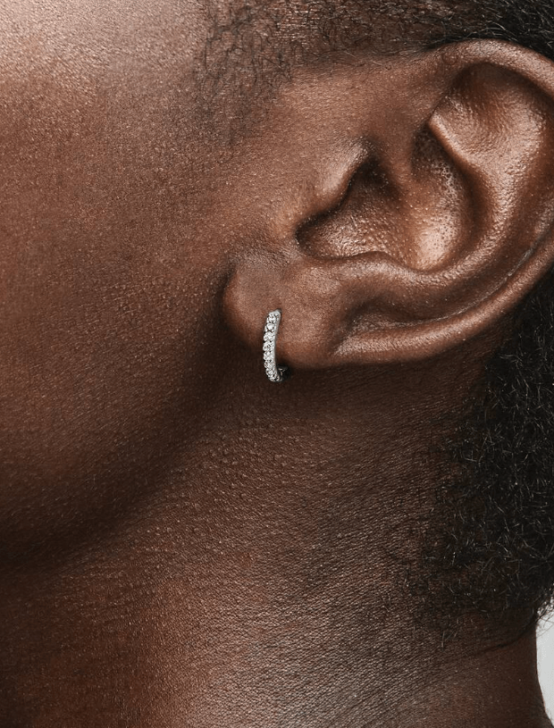 Female wears small hoop earrings