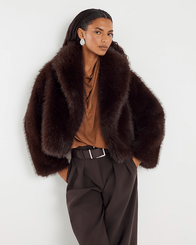 Female wears brown faux fur jacket