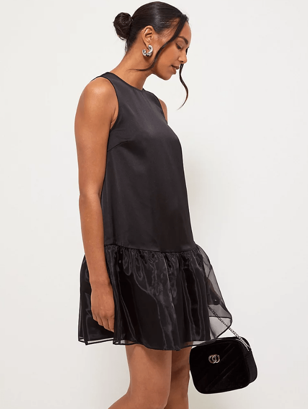 Female wears black dress with tulle hem