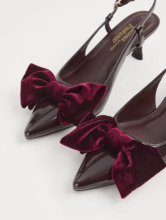 Close up image of burgundy bow heels