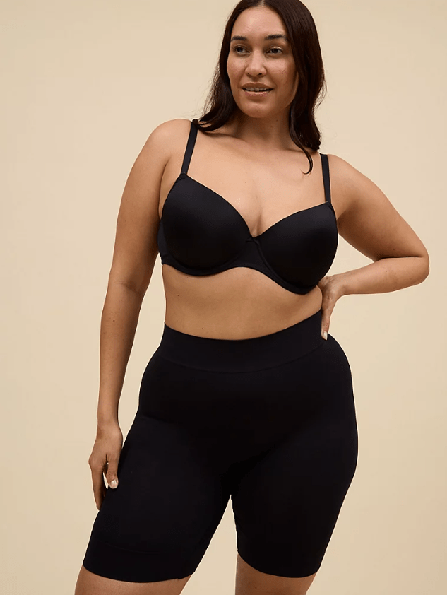 Female wears black bra and black shapewear shorts