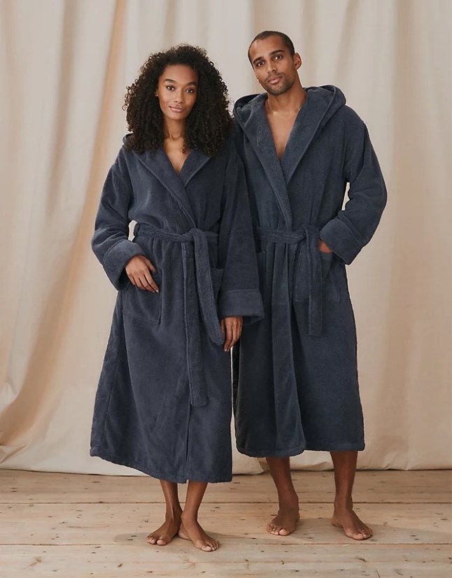 Male and female wearing navy blue robe