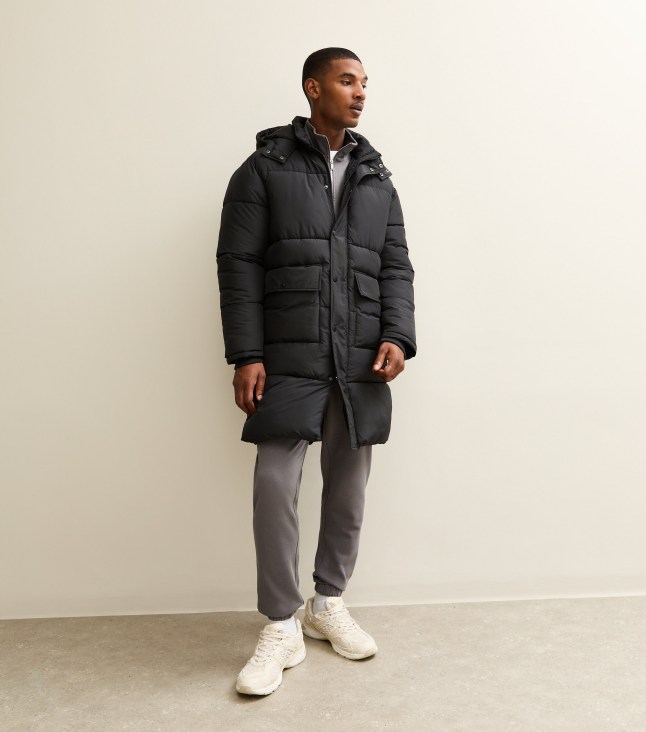 Male wears black puffa coat