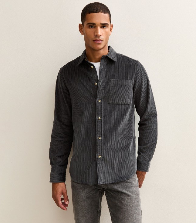 Male wears dark grey shirt