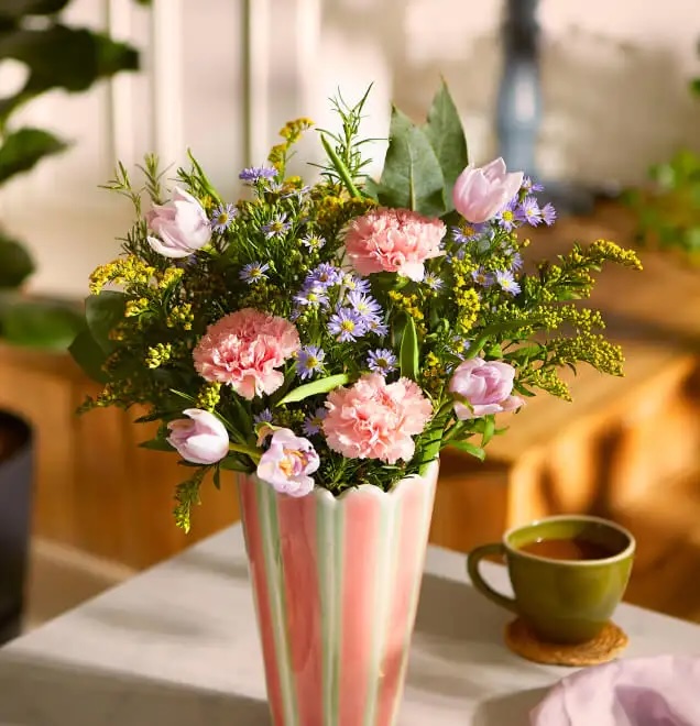 Bunch of flowers in striped vase