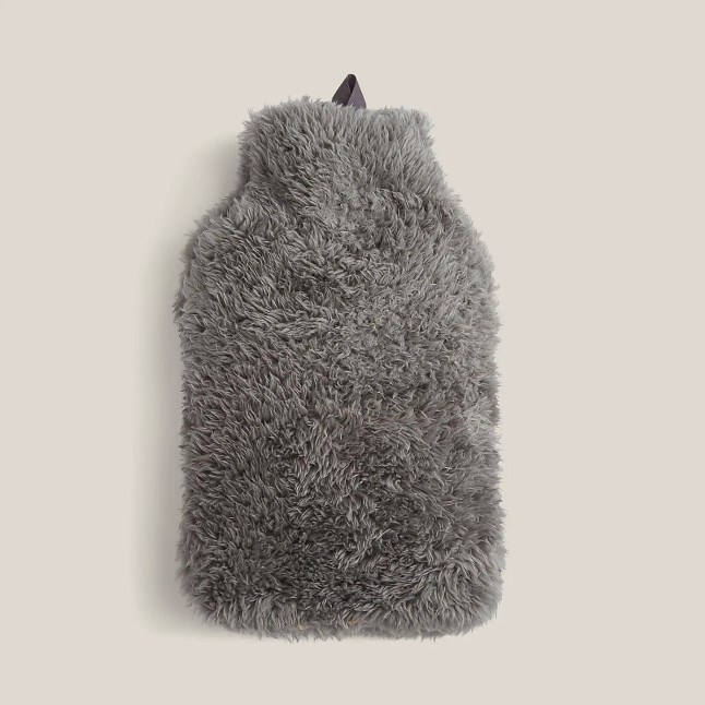 Grey hot water bottle with furry cover