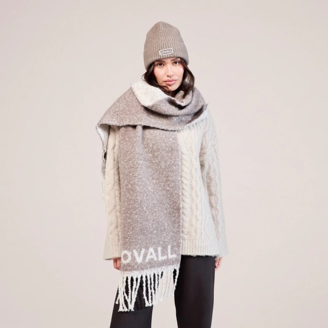 Female wears oversized scarf