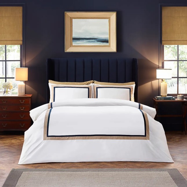 White bedding with black and gold boarder