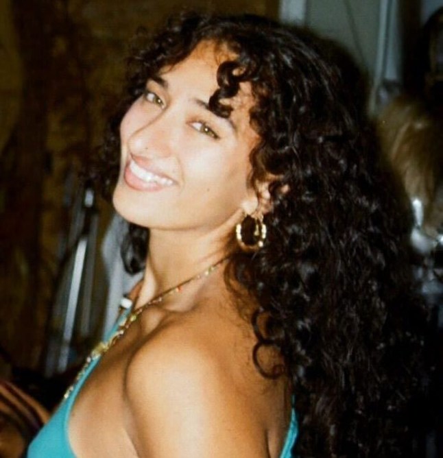 mia frank smiling in a blue top