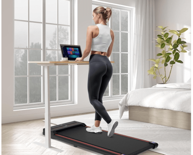 Woman walking on Sperax Walking Pad Treadmill from Amazon - looking out of the window