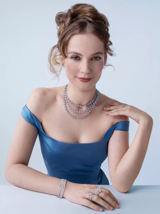 Female wears blue dress with jewellery