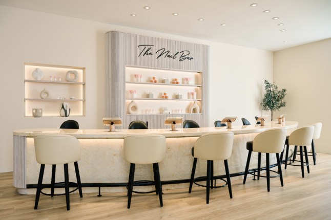 Nail salon with chairs at a high table