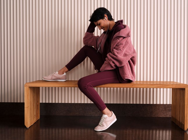 Female wears printed leggings and hooded jumper