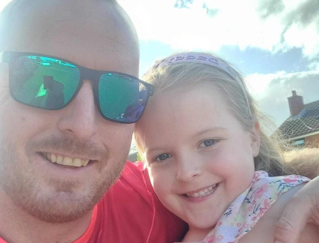 Robert and Stella-Lily smiling in the sun