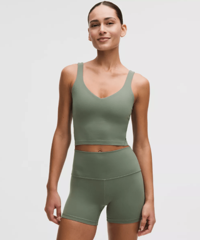 Female wears khaki green workout set