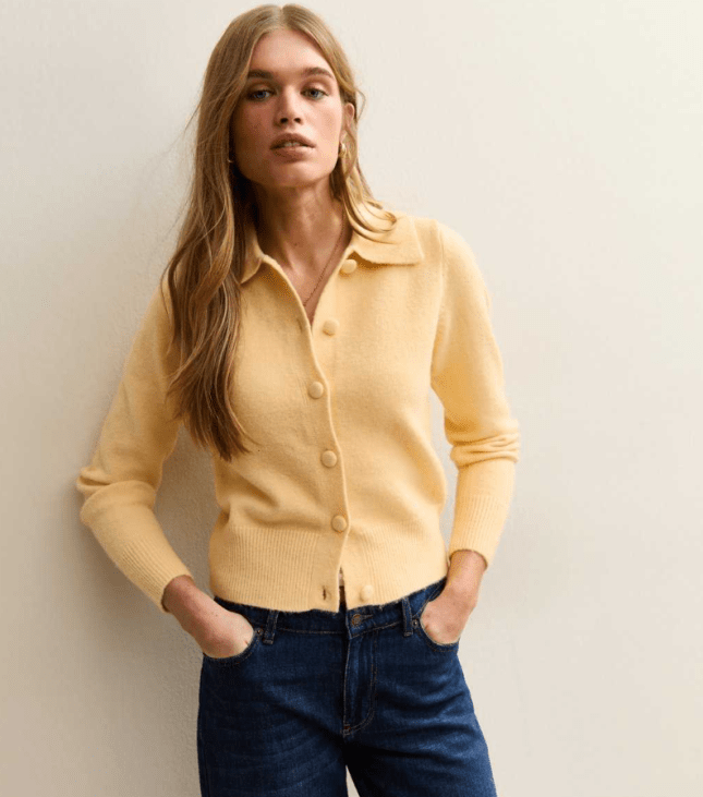 Female wears yellow New Look cardigan