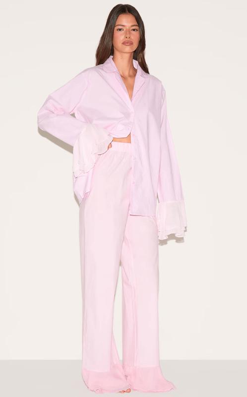 Female wears pink pjs with frill hem