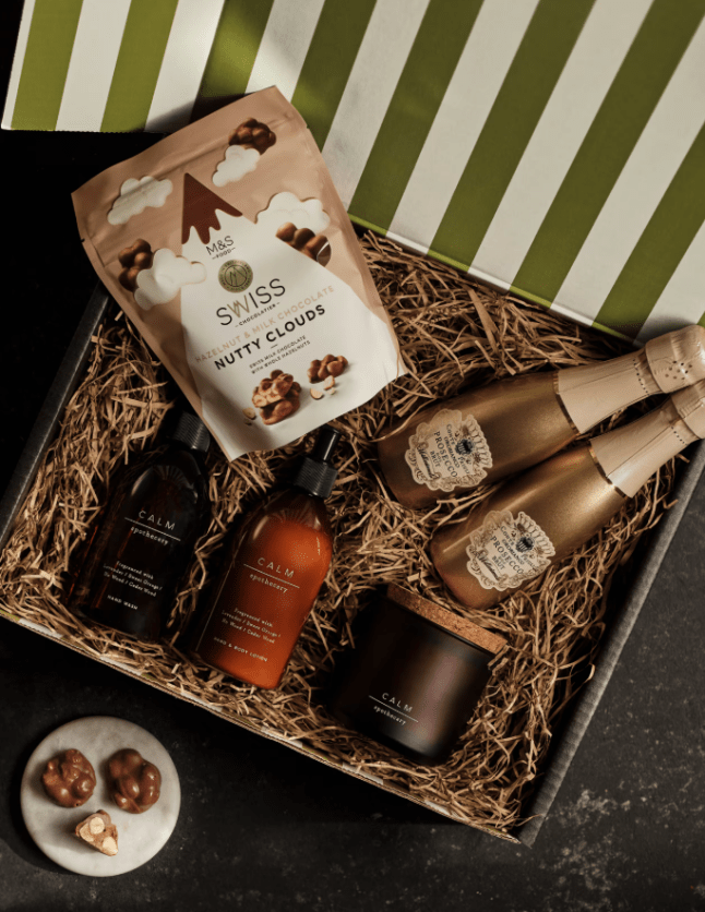 Hamper with body products, candle and prosecco