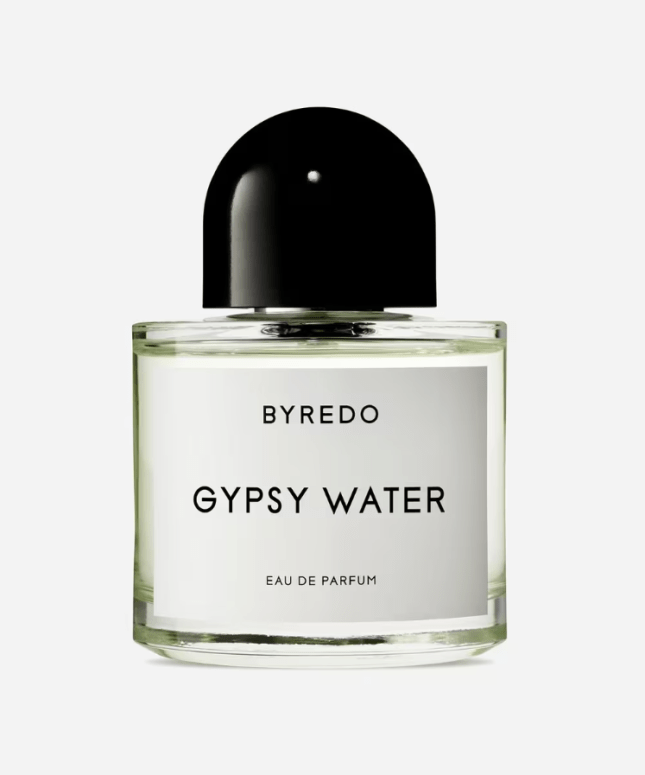 Bottle of perfume with black lid