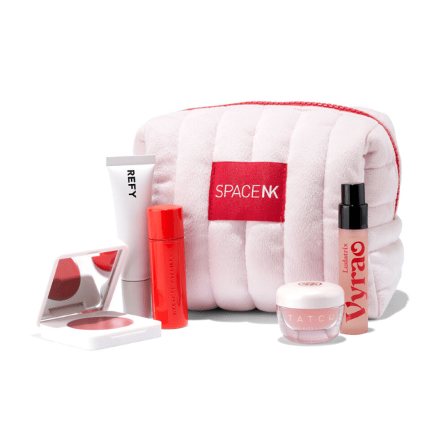 Beauty bag with makeup products sitting outside