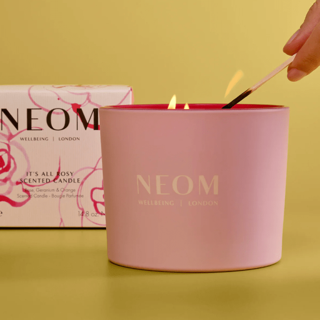 Pink candle being lit