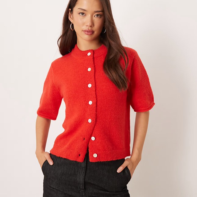 Female wears red cardigan