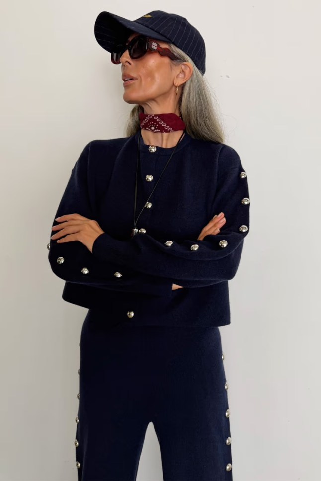 Female wears navy cardigan