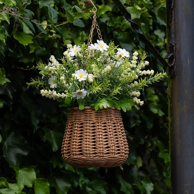 Hanging basket with white flowers inside